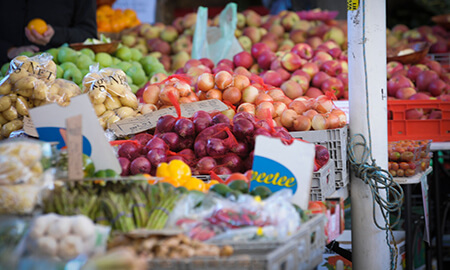 Fresh produce displayed on tables at a market