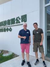 Chris Rodwell and Peter Morris outside a Chinese building hosting a wool delegation