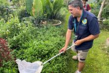 Indigenous ranger with butterfly net
